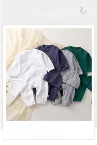 Detail of ribbed cotton long-sleeve baby rompers with matching knotted hats in multiple colors