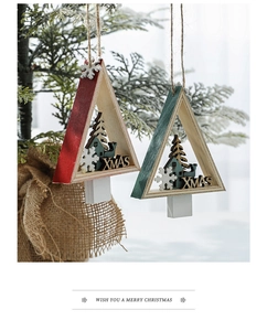 Detail of wooden triangle Christmas tree ornaments with reindeer and XMAS carvings