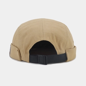 Khaki retro brimless docker hat with textured fabric and adjustable strap back