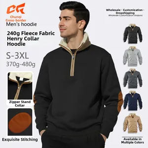 Detail of quarter-zip stand collar with fleece lining and elbow patches on men's sweatshirt
