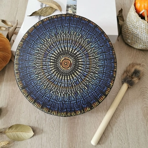 Detailed top view of the round shaman drum featuring a colorful mandala and wooden mallet