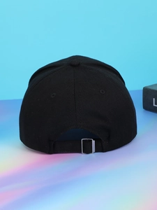 Detail view of the black denim baseball cap back featuring a silver metal adjustable buckle