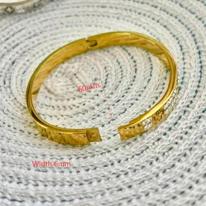 Titanium steel gold bangle with clover flower engraving and rhinestones, 6mm width