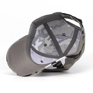 Detail view of the camouflage baseball cap interior with reinforced seams and grey underbrim