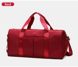 Detail view of red yoga gym bag showing water-resistant nylon fabric and functional pockets