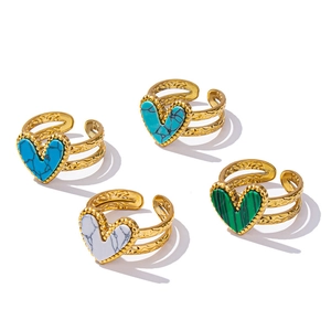 Set of four adjustable golden stainless steel heart rings with colorful stone inlays
