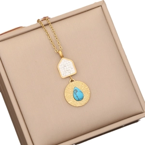 Gold stainless steel necklace with crystal house pendant and round turquoise stone