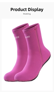Close-up of bright pink 3mm thick diving socks with OUZO logo and non-slip sole