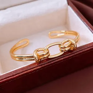 Bracciale a nodo placcato oro 18 carati con design minimalista a doppia linea lucida