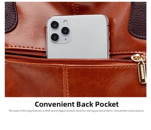 Detail shot of genuine leather shoulder bag featuring a convenient back zipper pocket and phone.