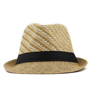 Detailed macro view of checkered straw weave and black ribbon on men's fedora sun hat