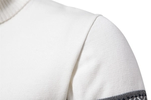 Detail shot of white fine knit sweater featuring high neck collar and grey geometric jacquard