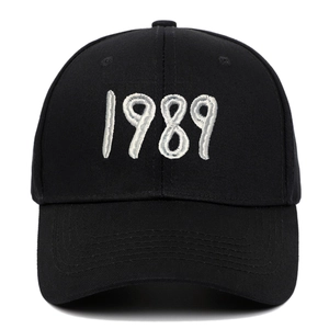 Black cotton baseball cap with white 1989 embroidery in a classic six-panel design