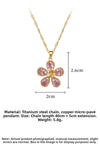 Detailed view of pink floral pendant necklace with crystal accents and gold chain link