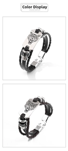 Detailansicht geflochtener Lederarmbänder mit gravierter Wolfskopf-Metallplatte