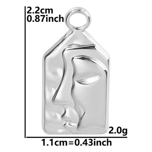 Macro detail of silver face relief pendant showing size dimensions and weight