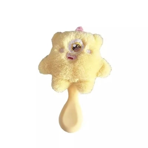 Cute yellow monster plush hairbrush with soft bristles and round handle on white background