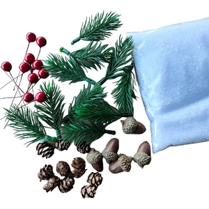 Christmas DIY decoration set with pine needles, red berries, pine cones and artificial snow