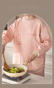 Close-up of pink waterproof apron with rabbit print and soft plush side pockets