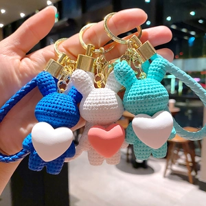 Cute knitted rabbit keychains with hearts and braided wrist straps in three colors