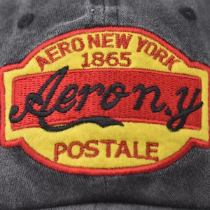 Ricamo dettagliato su cappello da baseball in cotone lavato con logo vintage 1865