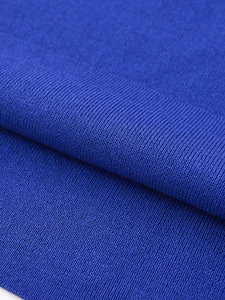 Macro shot of fine knit fabric structure in royal blue for a stylish women top