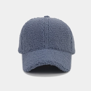 Detailed texture of thick grey-blue lamb wool material on a winter baseball cap