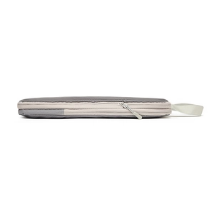 Slim side view of grey waterproof compression travel organizer showing zipper and handle