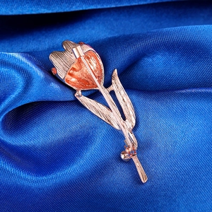 Detailed back view of a rose gold tulip brooch showing the pin buckle and metal texture