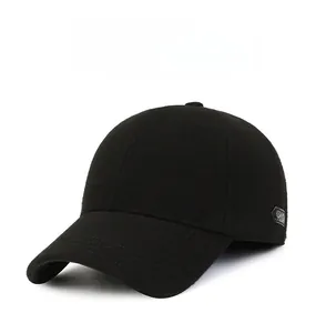 Close-up of the thick wool fabric and side branding on this black winter baseball cap