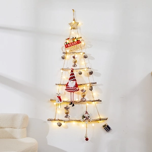 Detail of wooden Christmas tree wall hanging with LED lights and festive ornaments