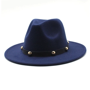 Detail of dark blue fedora with wide brim and black band featuring gold metal rivets