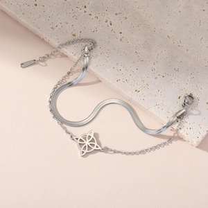 Double-layered stainless steel snake chain bracelet with witch knot pendant on stone base