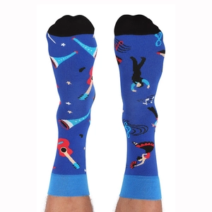 Detailed close-up of blue crew socks featuring flamingo dancer and guitar patterns