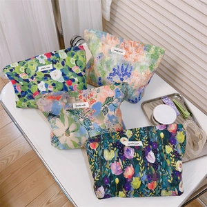 Detail of floral cotton makeup bags with simple wish labels in four watercolor patterns