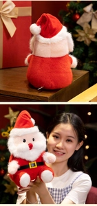 Detail of plush Santa Claus doll showing soft faux fur beard and festive red outfit textures