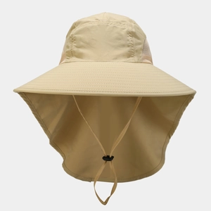 Detail view of breathable side mesh and adjustable windproof cord on beige sun hat