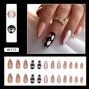 French almond press-on nails with black harlequin pattern and silver glitter accents