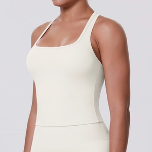 Detailed side view of cream-colored square neck sports tank top with smooth athletic fabric