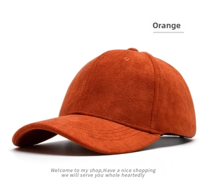Detail of the soft faux suede texture and precise stitching on the orange baseball cap