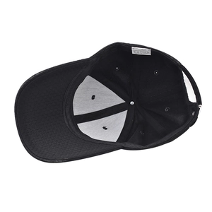 Internal view of minimalist black baseball cap with 100% polyester label and metal buckle