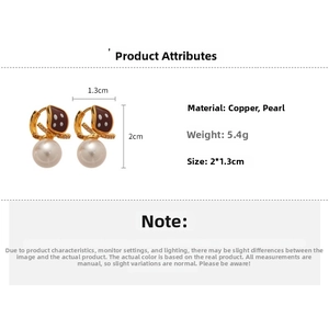 Detailed view of 18K gold dice earrings with white pearls including precise size dimensions