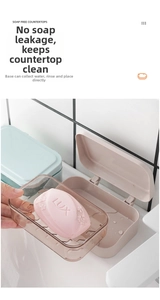 Detail of the double-layer soap box with a drainage tray and clear brown lid in the bathroom