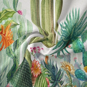 Detail shot of the bohemian tapestry featuring vivid watercolor cactus and flower prints