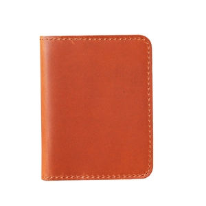 Macro view of vintage brown crazy horse leather card holder with detailed stitching
