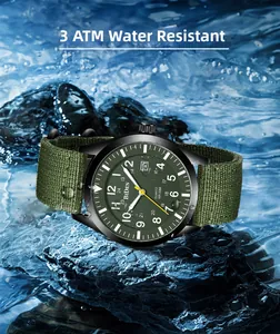 Rugged military quartz watch on wet black rock with dynamic blue water splashes