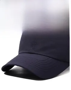 Close-up of navy blue baseball cap showing detailed narason embroidery and reinforced visor seams