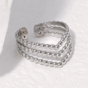 Macro shot of silver triple-layered beaded open ring made of durable stainless steel
