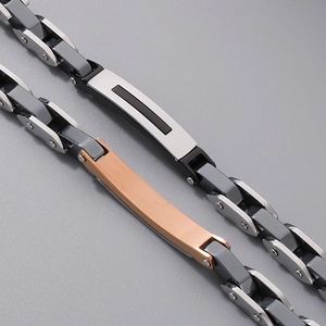 Macro detail of mechanical chain link bracelets in silver and rose gold finishes