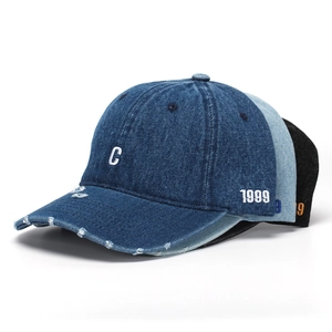 Close-up of distressed denim baseball caps with C embroidery and 1999 side branding detail